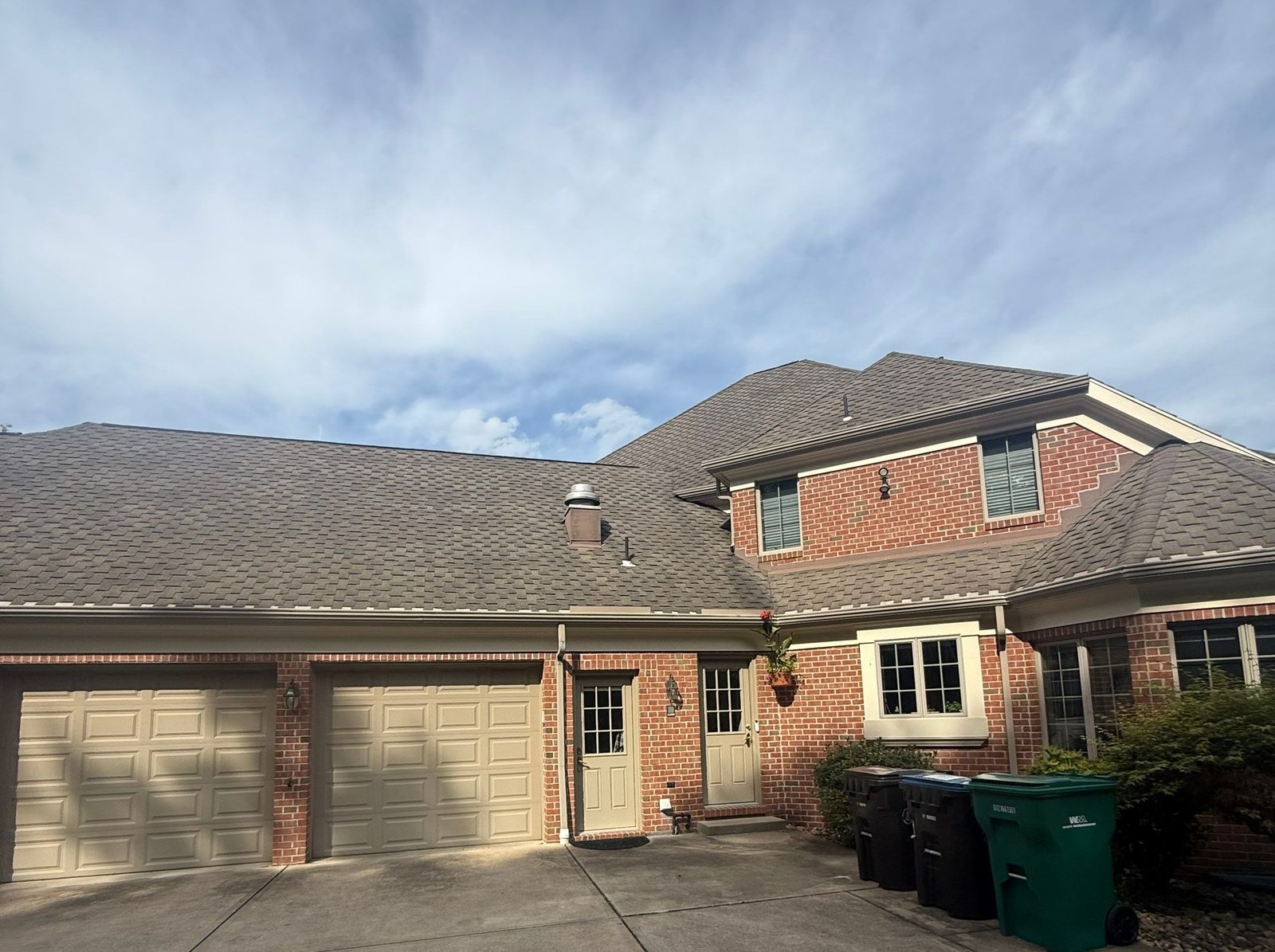Brick home with a three-car garage in Allison Park, PA, before its roof replacement.